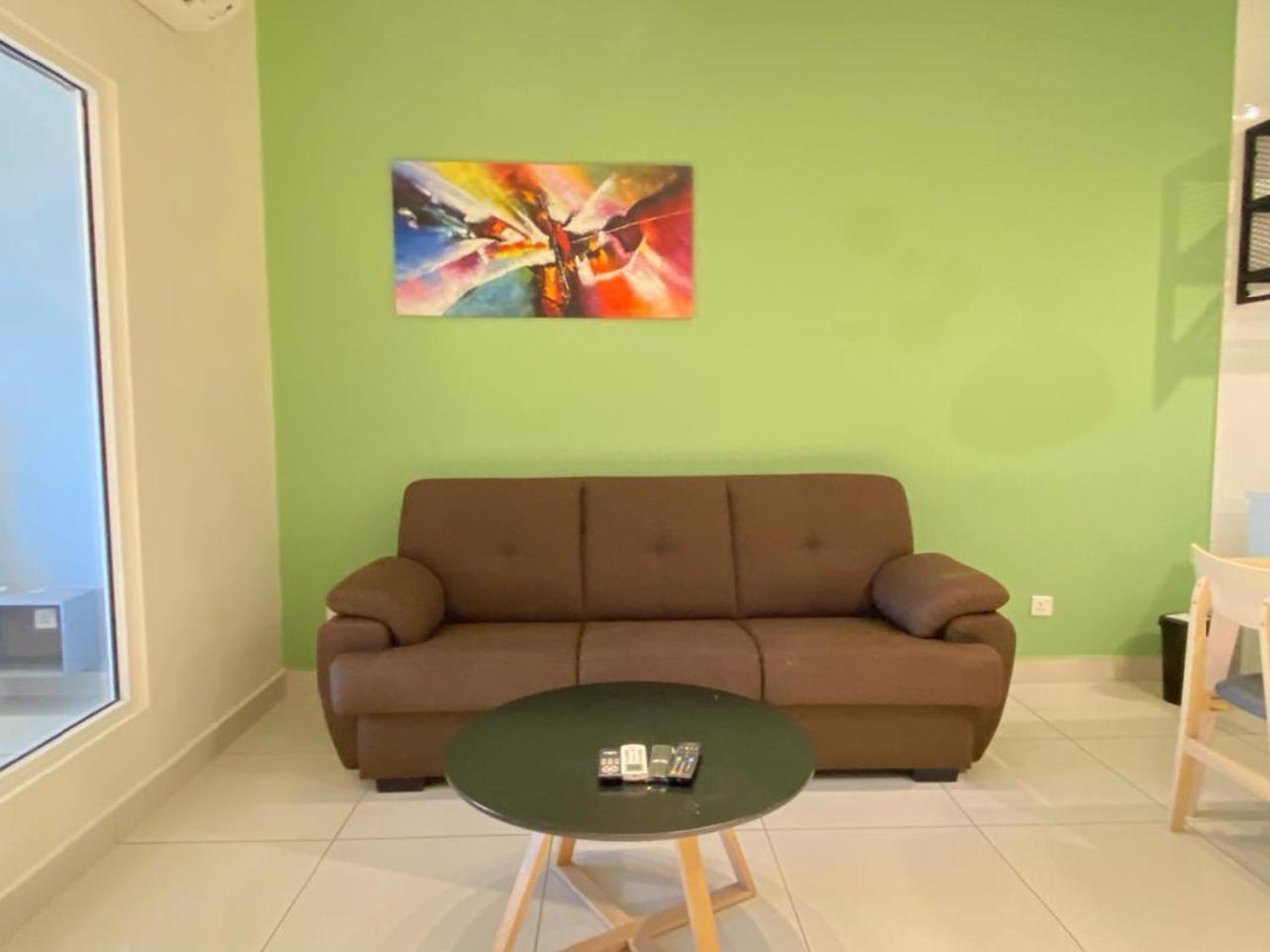 Arte Mont Kiara Aparthotel Kuala Lumpur Eksteriør bilde A living room with a sofa